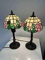 Front view of both lamps lit on tabletop