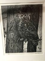 Black and white numbered owl print signed by N. Wilson, showing detailed owl perched on a tree with metal frame and white matting visible.