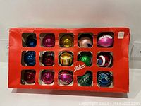 Original red box packaging for 15 vintage glass Christmas ornaments with divided compartments, branded 'Zellers'