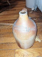Stoneware jug embossed with 'CAPRONI BROS. & Co. PROVIDENCE, R.I.' on the front