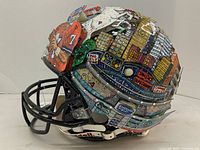 Full side view of hand-painted helmet showing overall pop-art design