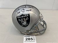 Angled side view showing Raiders logo and Jim Plunkett signature