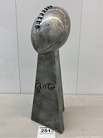 Front view of trophy showing overall design and signature location