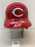 Front view of helmet showing team logo and autograph on bill