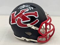 Front-left view of matte black mini helmet showing KC Chiefs logo and silver autograph