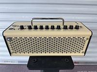 Front view of amp showing grille and handle