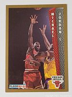 Front of the 1992-93 Fleer Michael Jordan basketball card featuring an action shot of Jordan in red Chicago Bulls uniform shooting over a defender in yellow jersey. Includes name, position, and team logo.