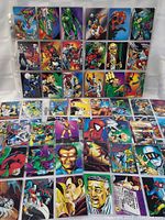 Full view of multiple Spiderman trading cards arranged in rows, showing a variety of characters and action scenes from the 1992 30th anniversary set.