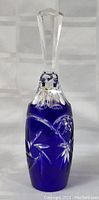 Blue glass bell with clear faceted top and hand cut floral patterns