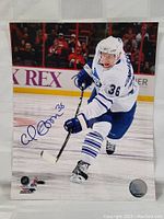 Photo of the 8x10 hand signed hockey photo showing Carl Gunnarsson skating, with the signature visible in blue ink.