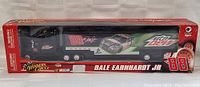 Front view of sealed NASCAR transport model box showing the No. 88 and Dale Earnhardt Jr. graphics with Mountain Dew branding.