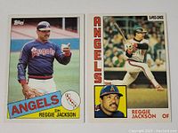Two baseball cards photos showing front of each card side by side: Topps and O-Pee-Chee featuring Reggie Jackson in Angels jerseys.