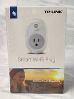 Front view of the sealed TP-LINK Smart Wi-Fi Plug box showing product image and branding.