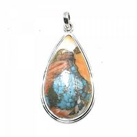 Front view of oyster turquoise teardrop pendant in sterling silver setting, showing detailed color and matrix patterns of the stone.