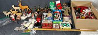 Wide shot of entire large lot of assorted vintage Christmas ornaments, various types and colors, including deer, birds, figurines, boxed items.