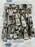 Top-down photo showing 22 vintage Danbury Mint English pewter model cars closely arranged in a container, highlighting the collection size and uniform silvery finish.