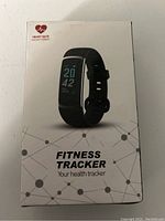 Front of the box showing the fitness tracker watch image and 'Fitness Tracker Your health tracker' text.