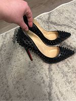 Side profile of pair showing spike coverage and heel shape