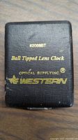 Closed black storage case with gold lettering displaying brand and tool type for Ball Tipped Lens Clock from Western Optical Supply Inc.
