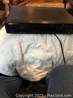 Front view of Marantz CD player showing model number and large playback display.