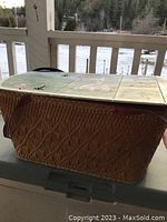 Side angle showing the woven wicker picnic basket structure with diamond pattern.