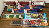 Overhead view of all HO scale box car kits and assembled models on tabletop