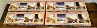 Four Walthers model train boxes showing the vintage Canadian National railcar themed art on the boxes.
