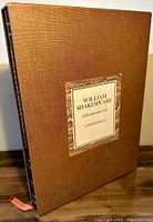 Leather slipcase with pastedown title label and Moroccan leather corners and spine