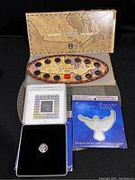 Two boxed sets with Canada Post Millennium Keepsake stamps and uncirculated 25 cent coins. The sets include booklets, packaging with Canada map and artwork, and protective coin casing.