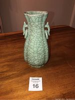 Front view of celadon crackle vase showing body shape and handles