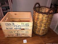 Wooden crate and woven wicker basket shown side by side against a kitchen background.