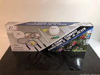 Boxed 4 game combo set from Eastpoint showing front panel with images of included sporting goods: racquets, balls, shuttlecock, net, and poles.