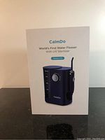 Box front showing CalmDo branding, product image, and model name Mesupure 1 Pro.