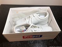 White walking shoes in original Propet box, new condition with tissue paper inside box.