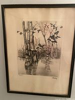 Full view of framed antique bird print showing water, trees, and flying birds