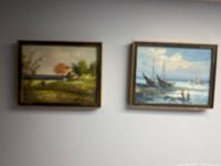 Two framed paintings including the shipping boat oil painting and a landscape painting.