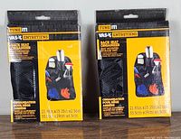 Front view of two Tune It back seat organizers in packaging showing product image and dimensions.