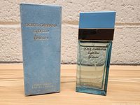 Front view of boxed Dolce & Gabbana Light Blue Forever Eau de Parfum bottle alongside the packaging box.