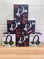 Front view of all six Flips Audio headphone boxes stacked with three white models and three black models.