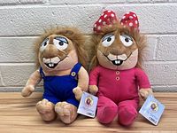 Pair of Little Critter stuffed toys displayed side by side, showing full front view with tags visible.