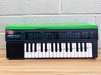 Front view of Yamaha Portasound PSS-130 keyboard showing control panel, brand label and keys with note names.