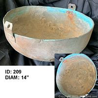 Front and interior view showing patina and wear inside the bowl with attached metal tabs on rim
