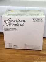 Box front with American Standard logo and “Complete Toilet” text