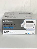 Front box showing DewStop Breeze Easy bath fan with fan control, new sealed box.