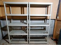 Two grey resin 5-shelf storage shelving units side by side, showing overall structure and design.