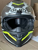 Front view of the HJC motorcycle helmet showing full face shield and interior padding.