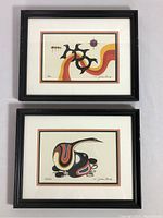 Front view of two framed Jackson Beardy prints stacked vertically