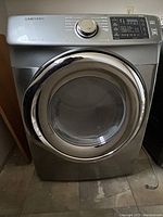 Front view of the Samsung dryer showing door and brand name.