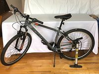 Side profile of Schwinn High Timber bike with Bell pump beside rear wheel