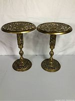 Pair of solid brass accent tables/plant stands with ornate openwork tops and bases